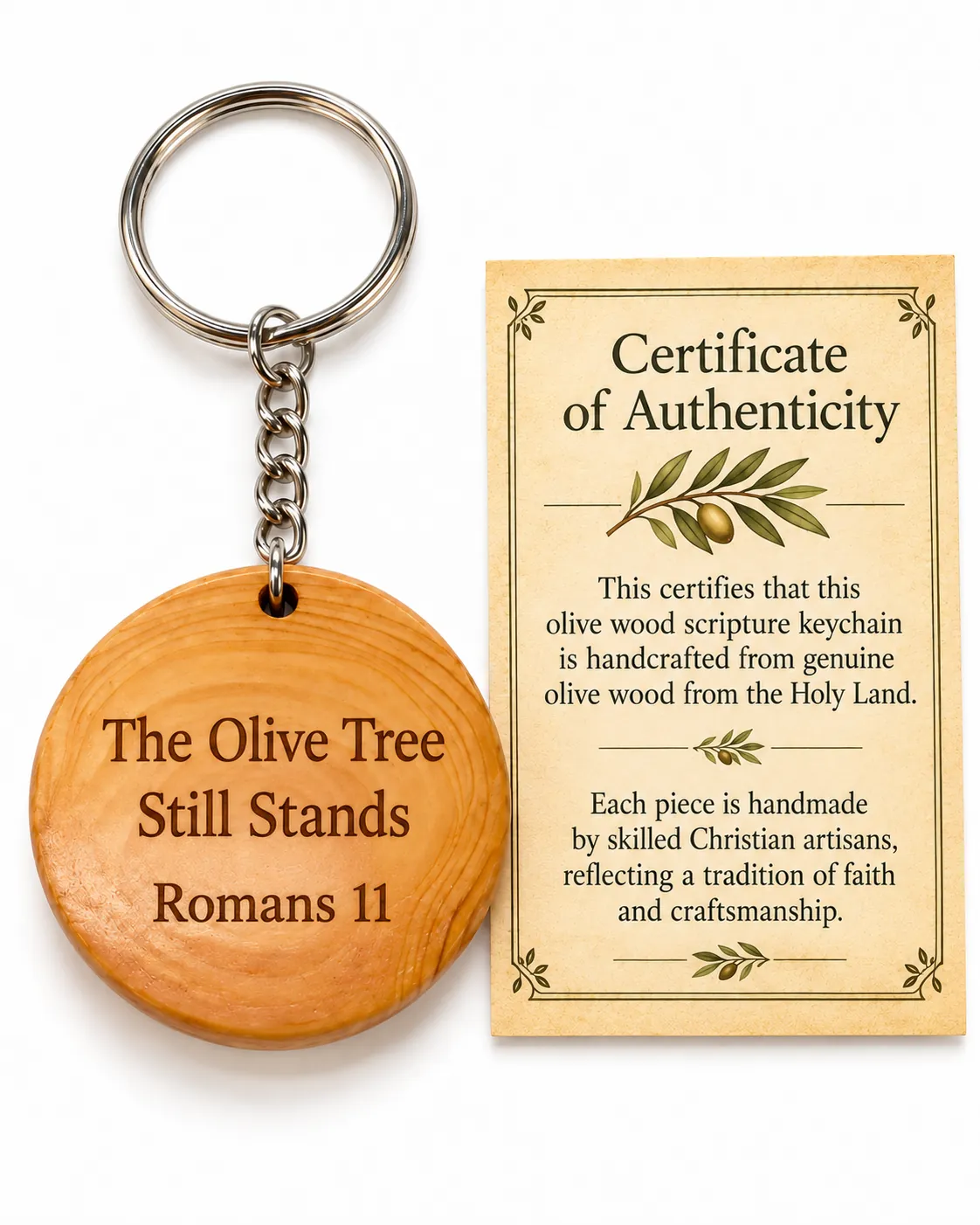 Olive wood keychain engraved The Olive Tree Still Stands, Romans 11, beside its certificate of authenticity