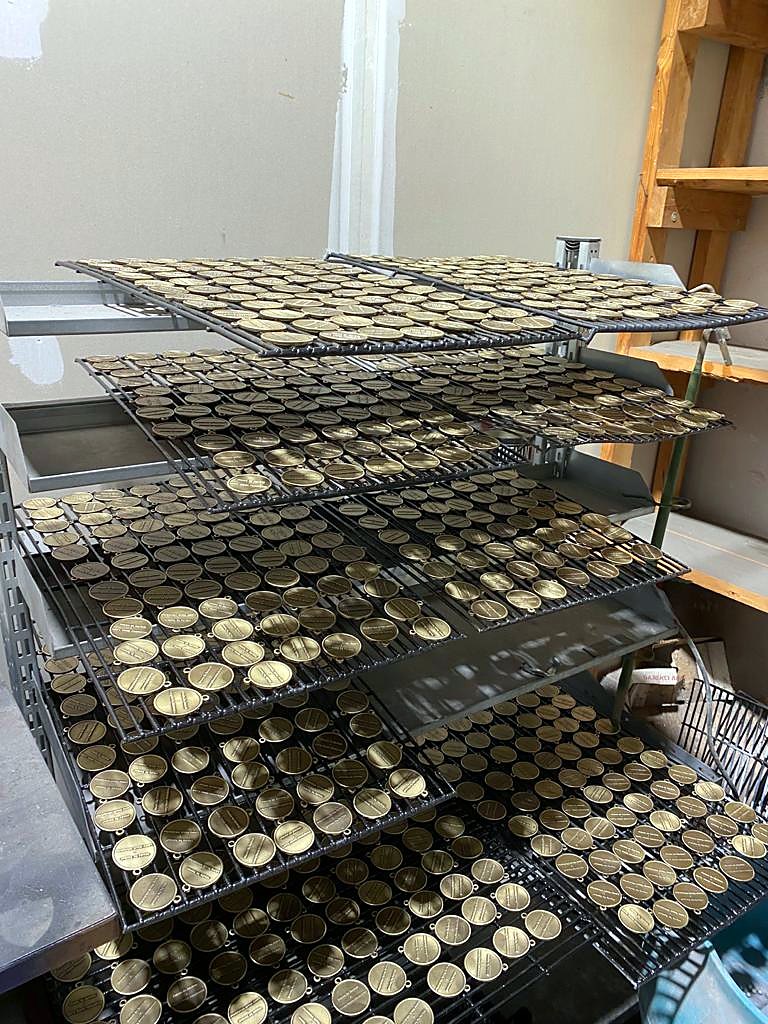 Finished coin and Jerusalem stone gifts laid out for inspection