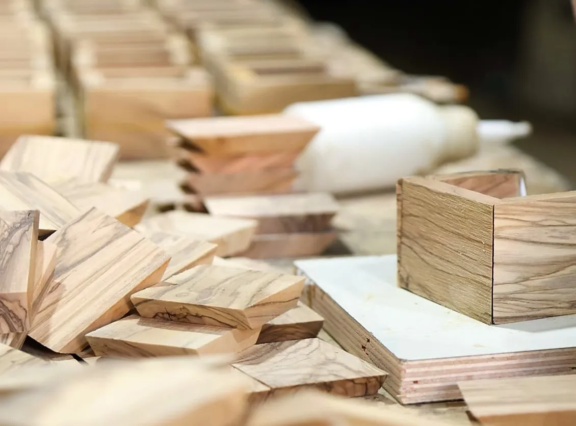 Olive wood gifts and gift boxes being assembled in our Holy Land workshop