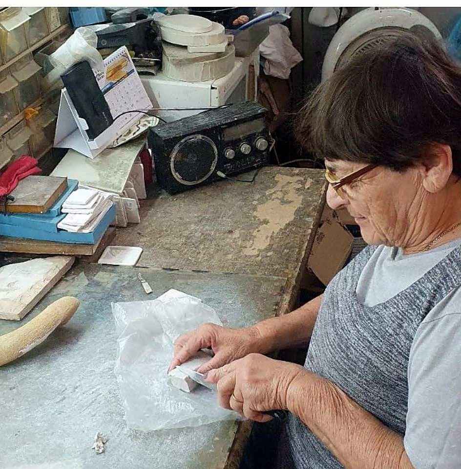 Artisan shaping a natural shofar by hand