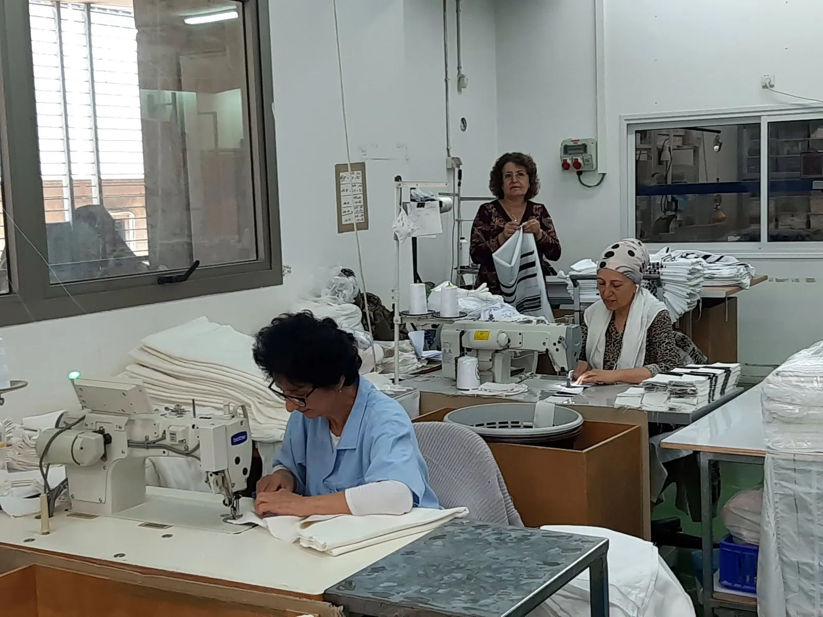 Artisans sewing in our workshop